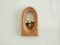 Front view of an elegant arched wood art frame, featuring a portal-like silhouette and smooth hand-sculpted finish.