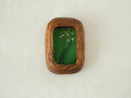 Front view of the Rounded Rectangle handmade solid wood art frame in a vertical orientation, featuring a painting of white birds flying over a dense green forest.