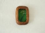 Front view of the Rounded Rectangle handmade solid wood art frame in a vertical orientation, featuring a painting of white birds flying over a dense green forest.