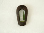 Front view of a slim black arched wood frame, featuring a minimalist silhouette and rich dark grain texture.