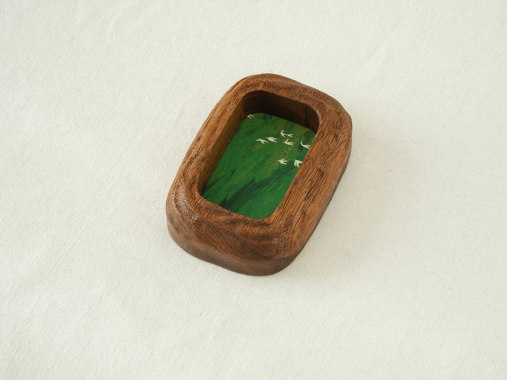 Close-up angled view of the rounded rectangle solid wood frame, emphasizing the handcrafted texture and the natural, flowing curves of the timber edges.