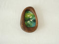 Front view of the Waterdrop handmade solid wood art frame featuring birds flying over a lush forest, highlighting the organic pebble shape and natural wood grain.