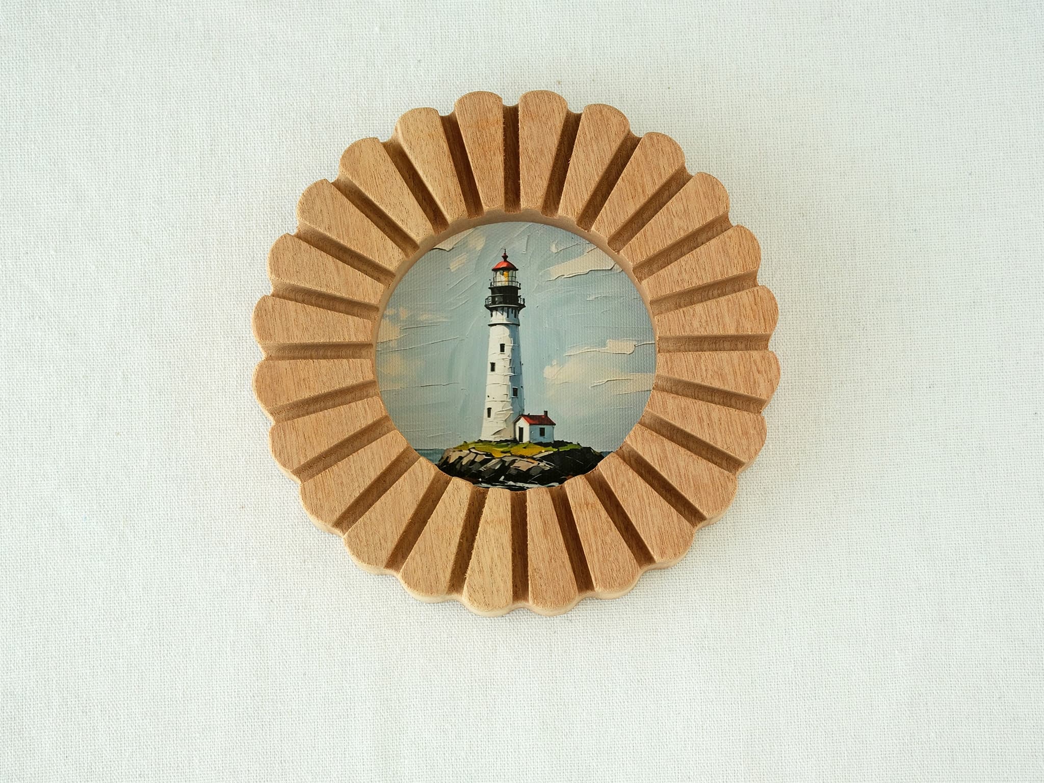 Front view of the sunflower circular solid wood frame with a lighthouse art print, featuring a grooved sunburst design.