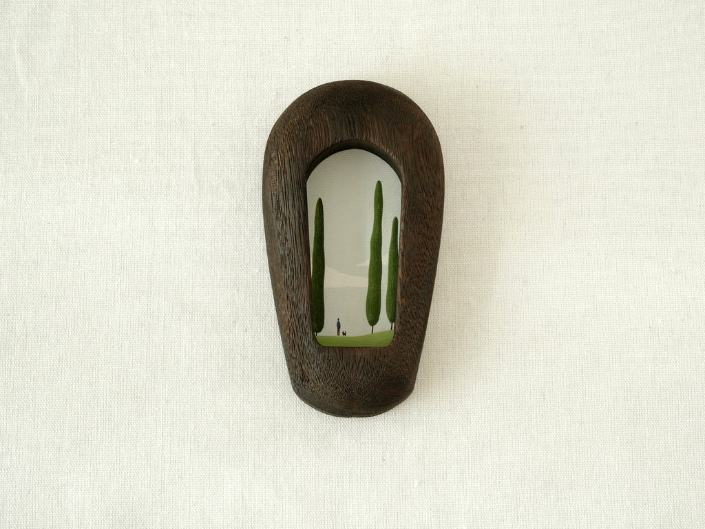 Front view of a slim black arched wood frame, featuring a minimalist silhouette and rich dark grain texture.