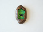 Front view of the Irregular Organic handmade solid wood art frame, featuring a charming illustration of a black cat walking through a field of yellow flowers.
