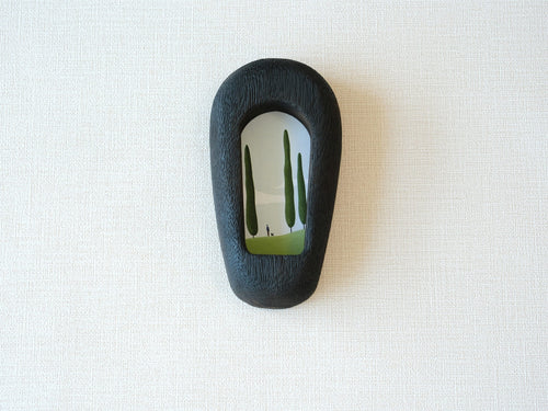Front view of a slim black arched wood frame, featuring a minimalist silhouette and rich dark grain texture.
