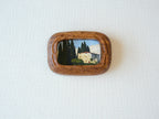 Handcrafted South American walnut wood picture frame with organic chunky shape and a landscape art print.