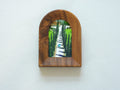 Front view of the arched solid wood frame "Tuscany," featuring a handcrafted stepped border and an oil-style painting of a cypress-lined road leading to an Italian villa.