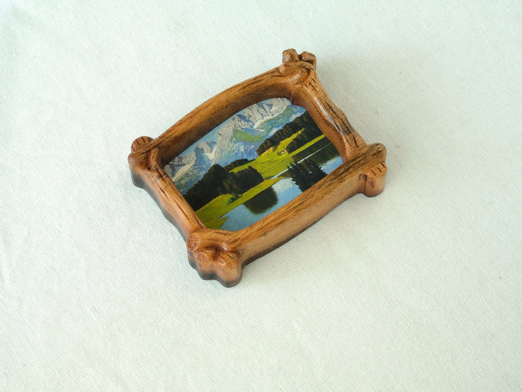 A top-down perspective of the organic wood frame, highlighting its unique branch-shaped silhouette and natural wood grain.
