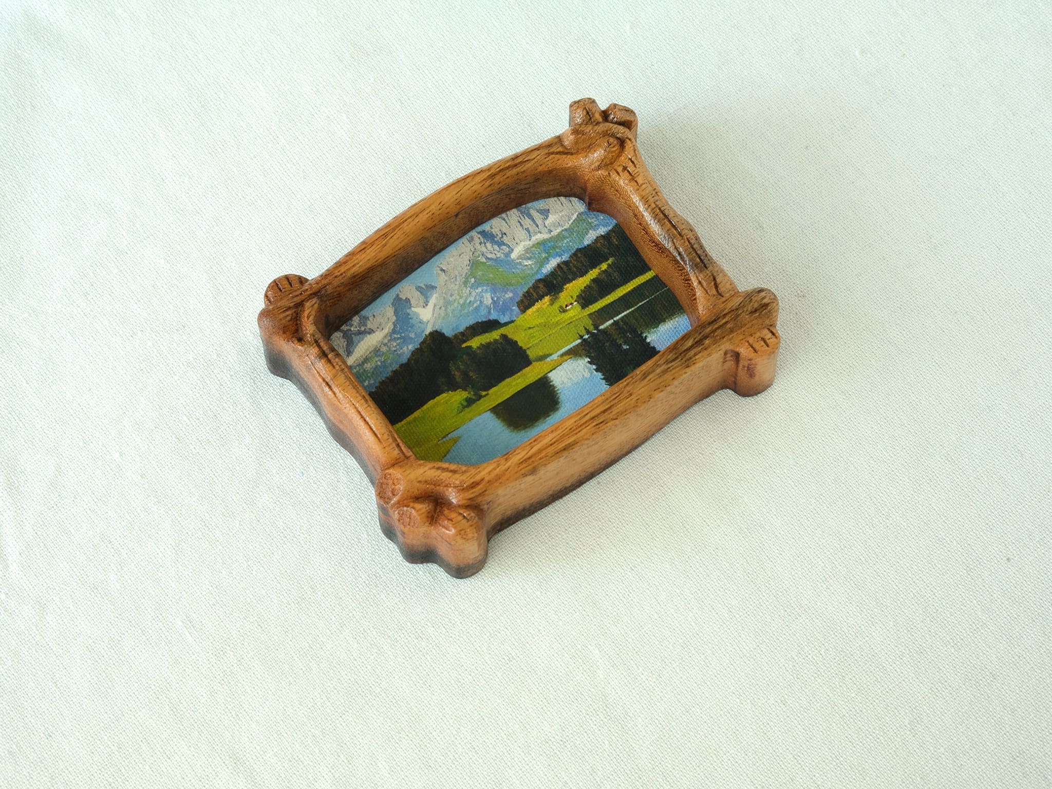 A top-down perspective of the organic wood frame, highlighting its unique branch-shaped silhouette and natural wood grain.