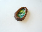 Side view of the Waterdrop handmade solid wood art frame, showcasing the thick pebble-like profile, smooth hand-polished edges, and the depth of the forest birds artwork.