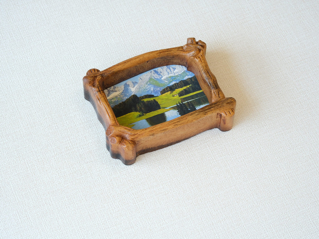 A top-down perspective of the organic wood frame, highlighting its unique branch-shaped silhouette and natural wood grain.