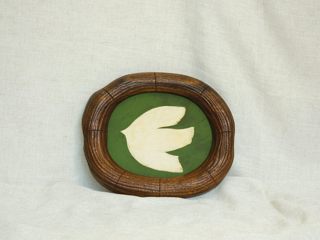 Large walnut wood wall art picture frame with dove artwork, leaning display.