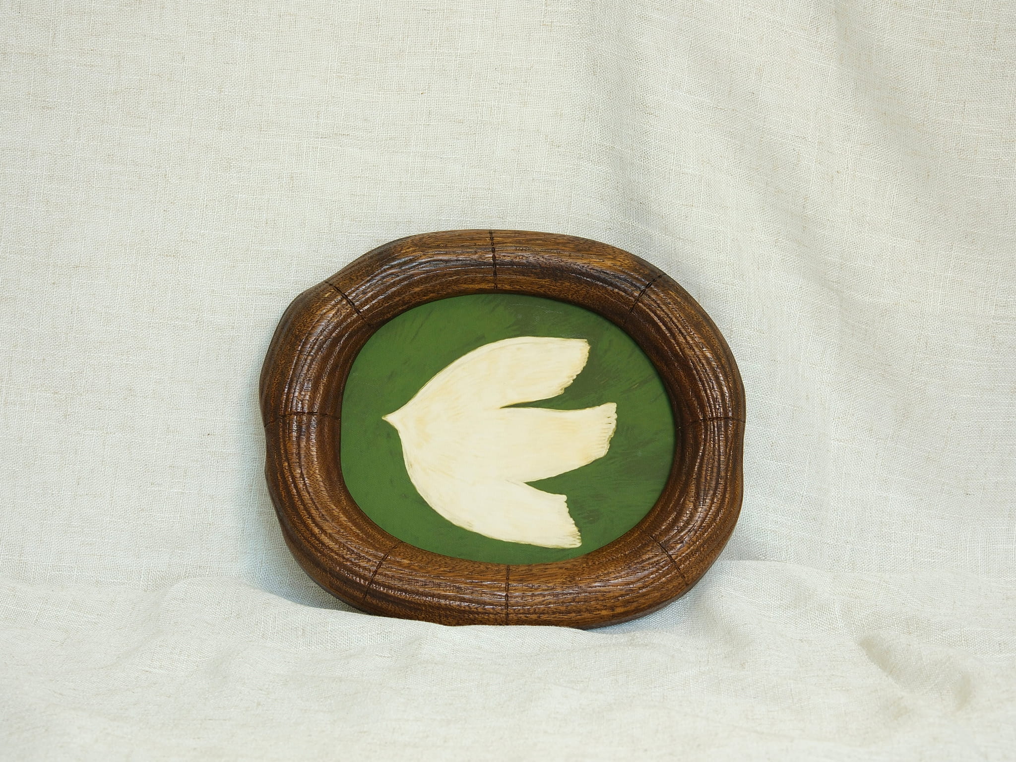 Large walnut wood wall art picture frame with dove artwork, leaning display.