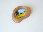 Side view of the cloud-shaped wood art frame, showing hand-sculpted organic curves and its sculptural depth.
