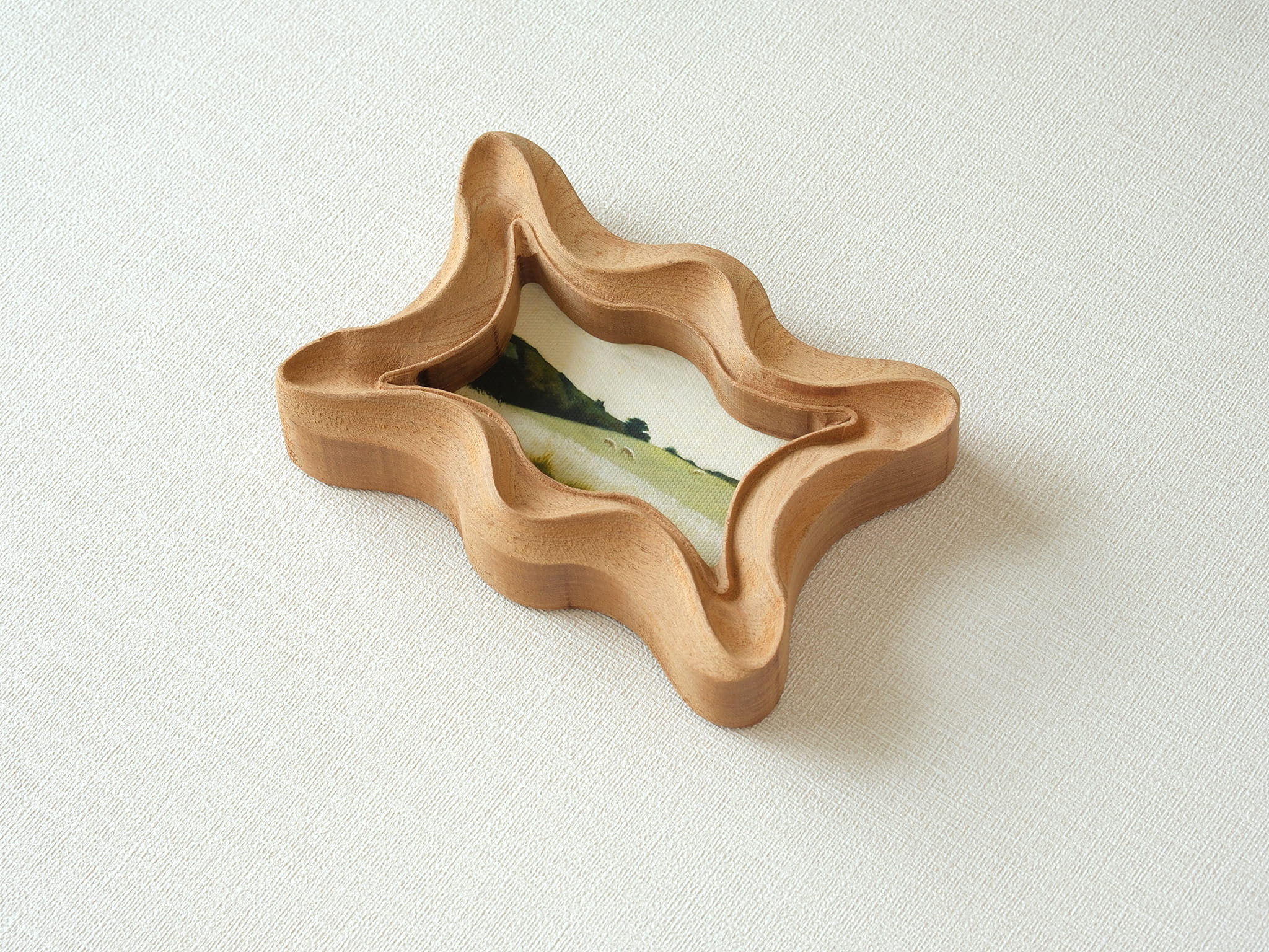 Alternative angled view of the rippled wave wood frame, showcasing its rhythmic undulating edges and artisan craftsmanship.