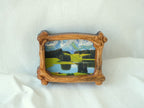 Handmade wooden frame, displayed against the wall.