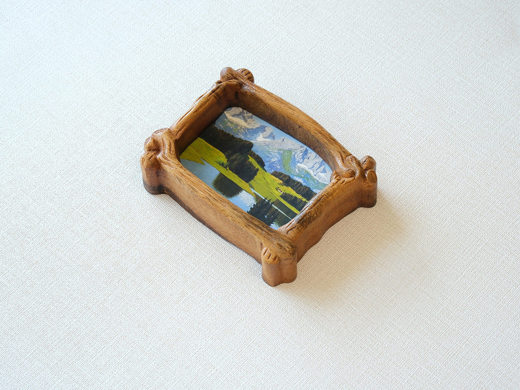 A top-down perspective of the organic wood frame, highlighting its branch-shaped silhouette and natural wood grain.