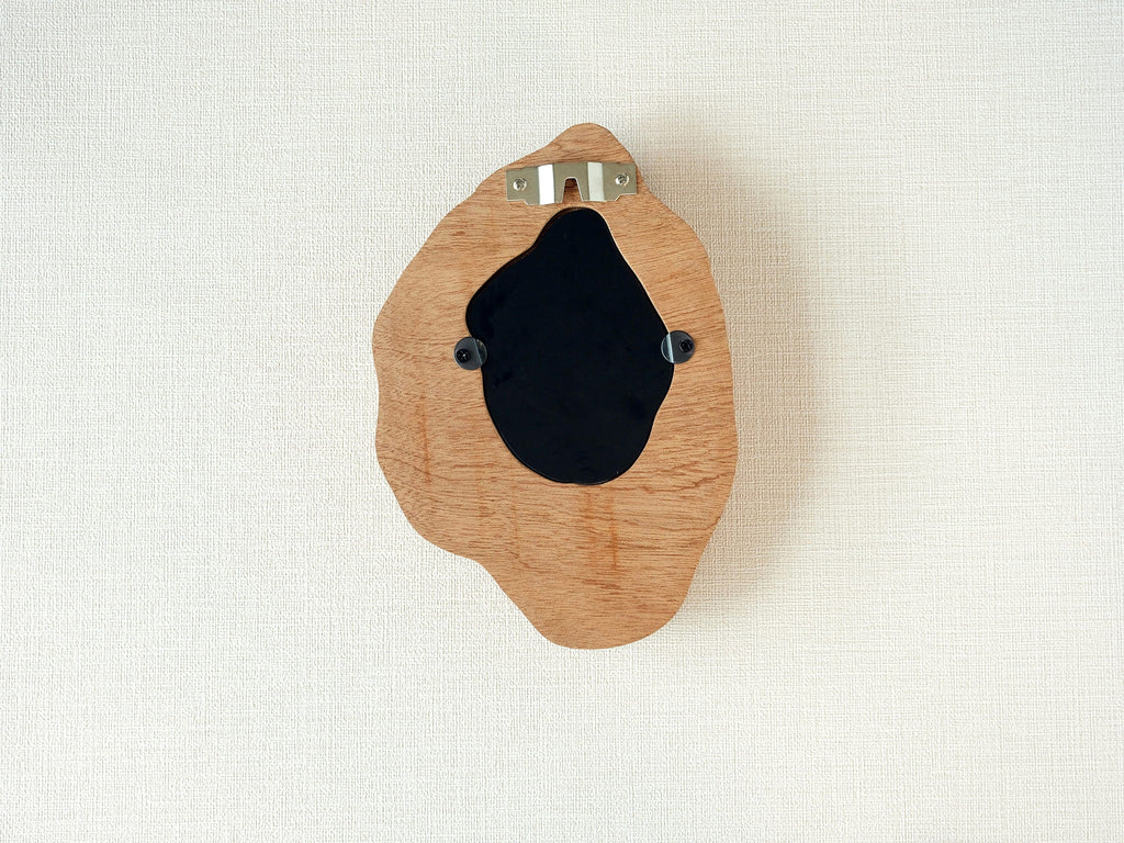 Back view of handmade solid wood wall hanging art picture frame with metal hanging hardware and removable back panel.