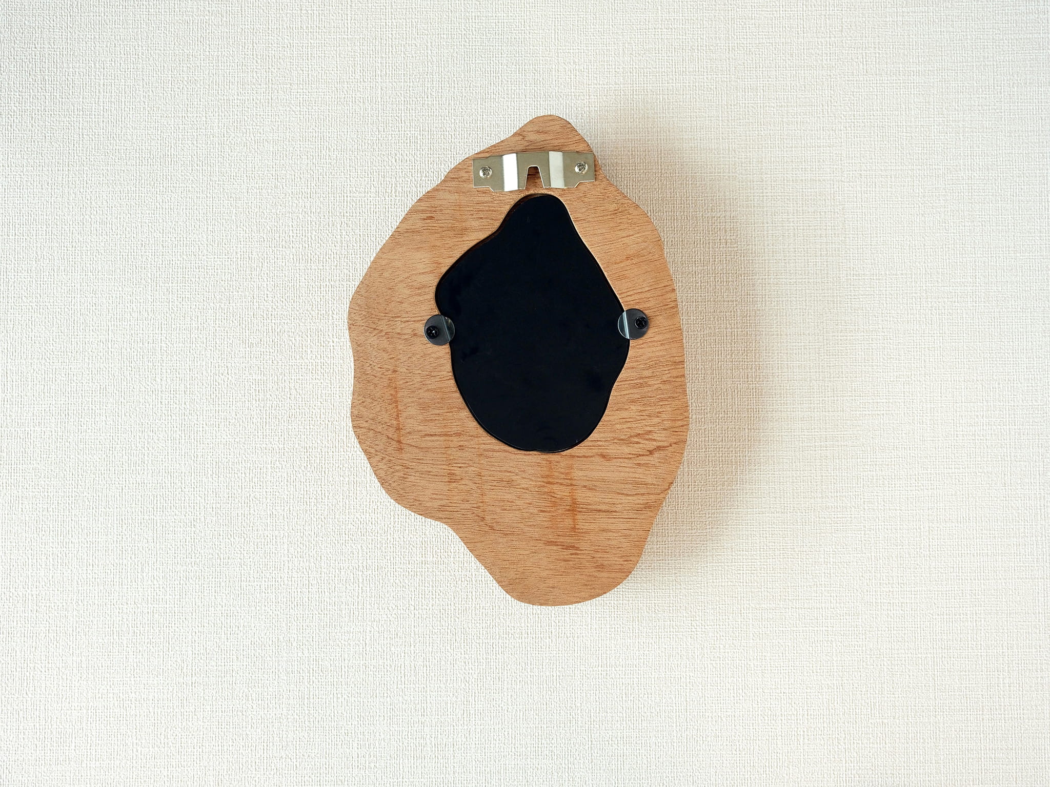 Back view of handmade solid wood wall hanging art picture frame with metal hanging hardware and removable back panel.