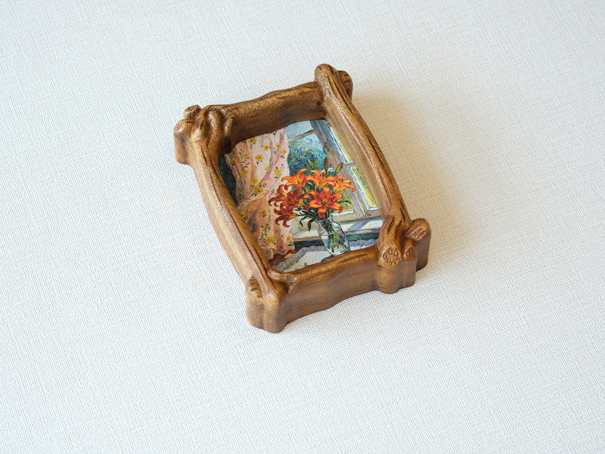High-angle view of the organic solid wood frame, showing the natural wood grain and handcrafted sculptural details.