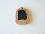 Back view of the house-shaped frame, featuring a sturdy sawtooth wall hanger and secure swivel tabs for artwork.
