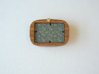 Back view of the walnut frame showing the wall hanger and easy-to-use clips for swapping art or personal photos.