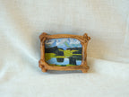 Handmade wooden forest art frame for desktop decor with green tree landscape miniature design.