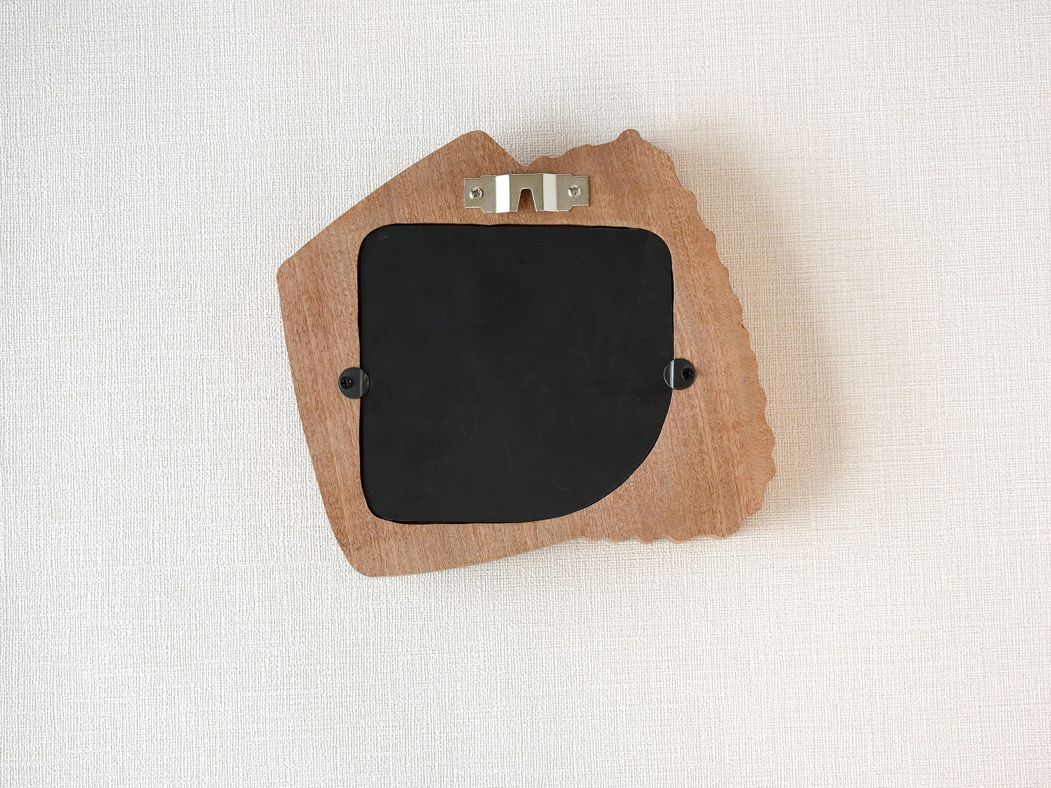 Back view of accordion-inspired solid wood wall hanging picture frame with metal hook and removable back panel.