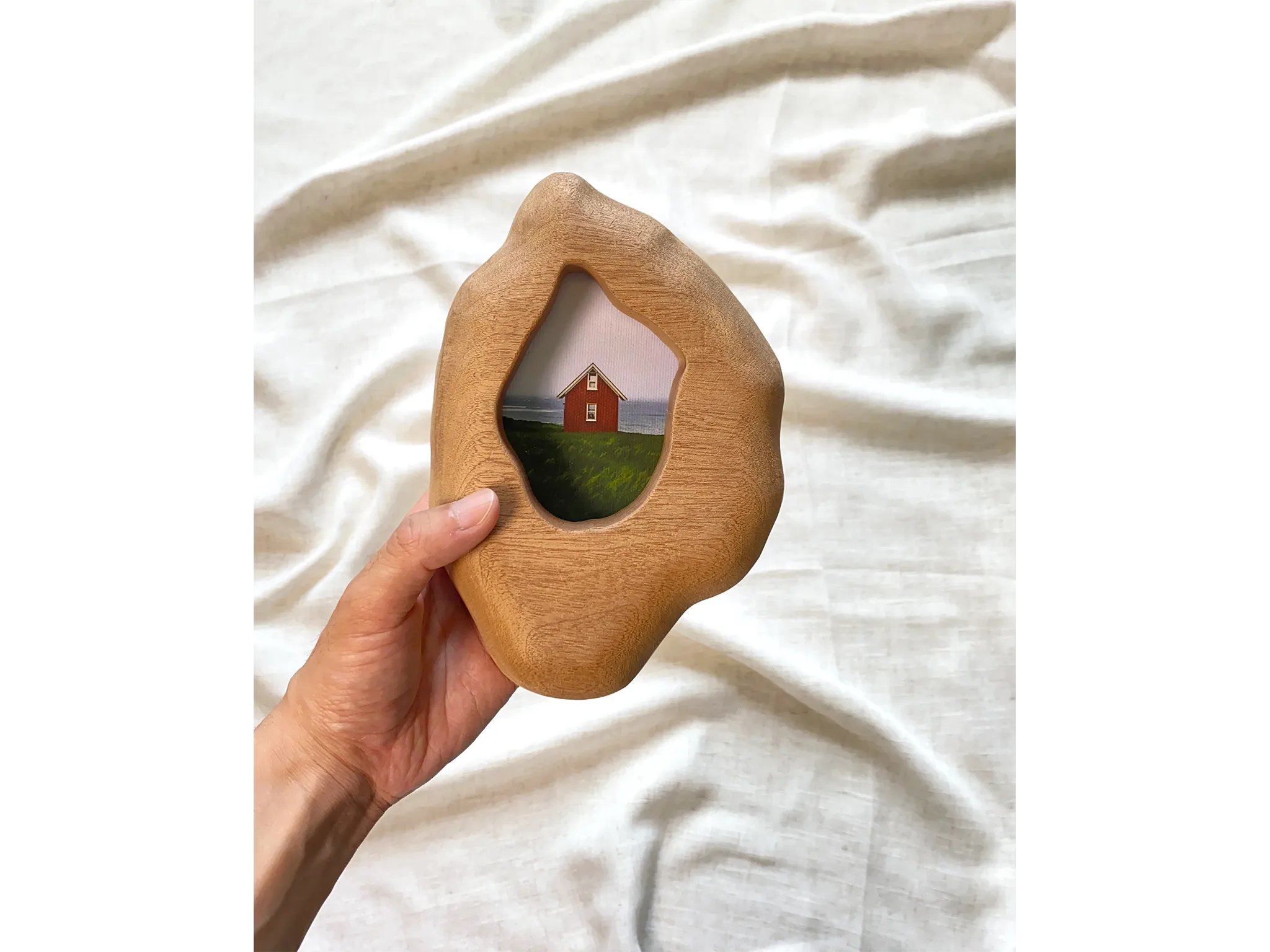 Solid wood wall hanging art picture frame with red house artwork, hand held display.