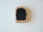 Back view of the soft arched wood frame, showing the integrated wall hook and secure swivel tabs for easy photo setup.