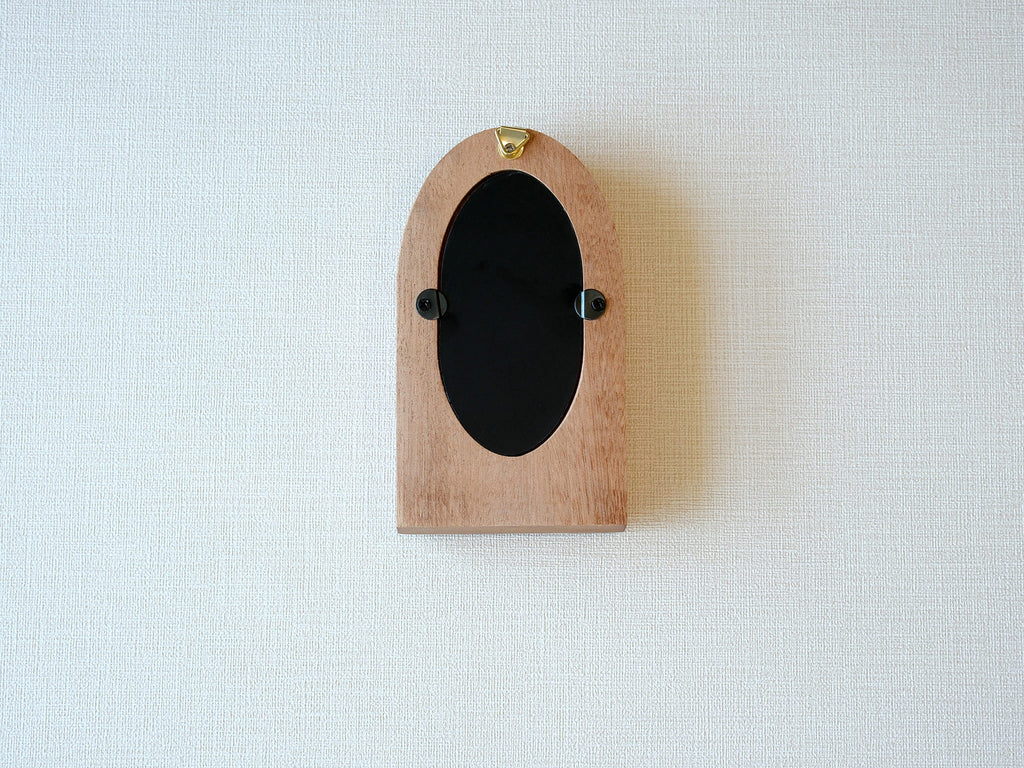 Back view of the arched wood frame, featuring a built-in metal hanger and secure turn-button hardware.