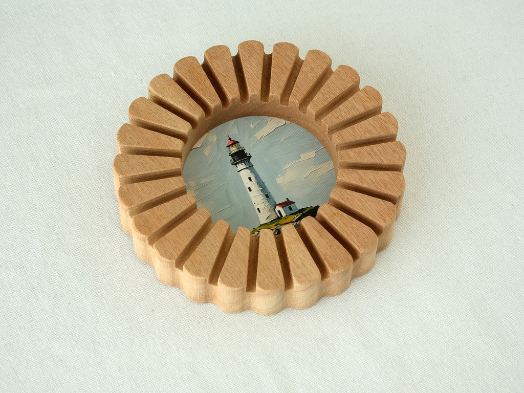 A high-angle view of the sunflower circular solid wood frame lying on a white textured surface, highlighting its natural wood grain.
