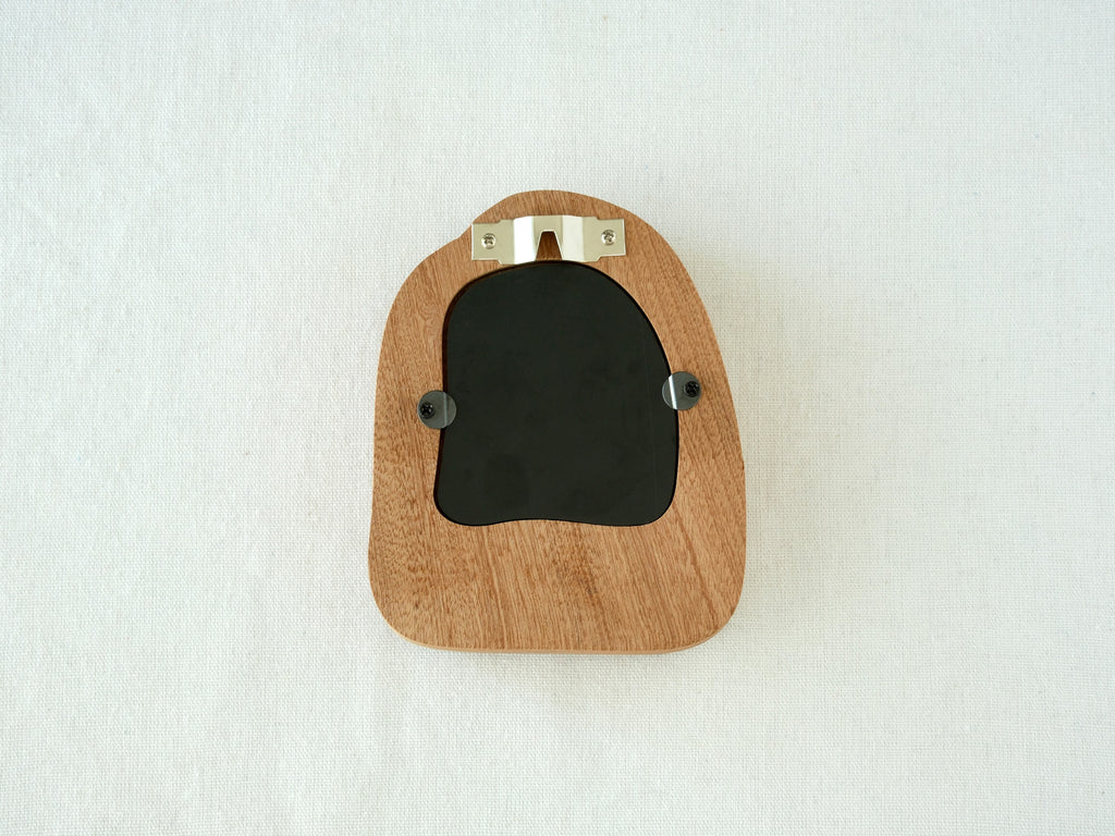 Back view of the house-shaped frame, featuring a sturdy sawtooth wall hanger and secure swivel tabs for artwork.