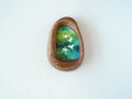 Front view of the Waterdrop handmade solid wood art frame featuring birds flying over a lush forest, highlighting the organic pebble shape and natural wood grain.