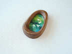 Side view of the Waterdrop handmade solid wood art frame, showcasing the thick pebble-like profile, smooth hand-polished edges, and the depth of the forest birds artwork.