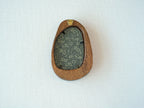 Rear view of the Waterdrop solid wood frame, showcasing its organic pebble-like profile and the integrated gold hanger for easy wall mounting.