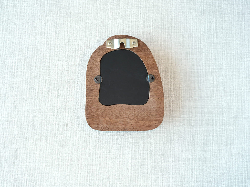 Back view of the house-shaped frame, featuring a sturdy sawtooth wall hanger and secure swivel tabs for artwork.