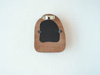 Back view of the house-shaped frame, featuring a sturdy sawtooth wall hanger and secure swivel tabs for artwork.