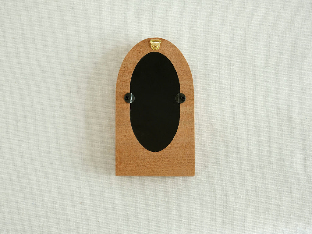 Back view of the arched wood frame, featuring a built-in metal hanger and secure turn-button hardware.