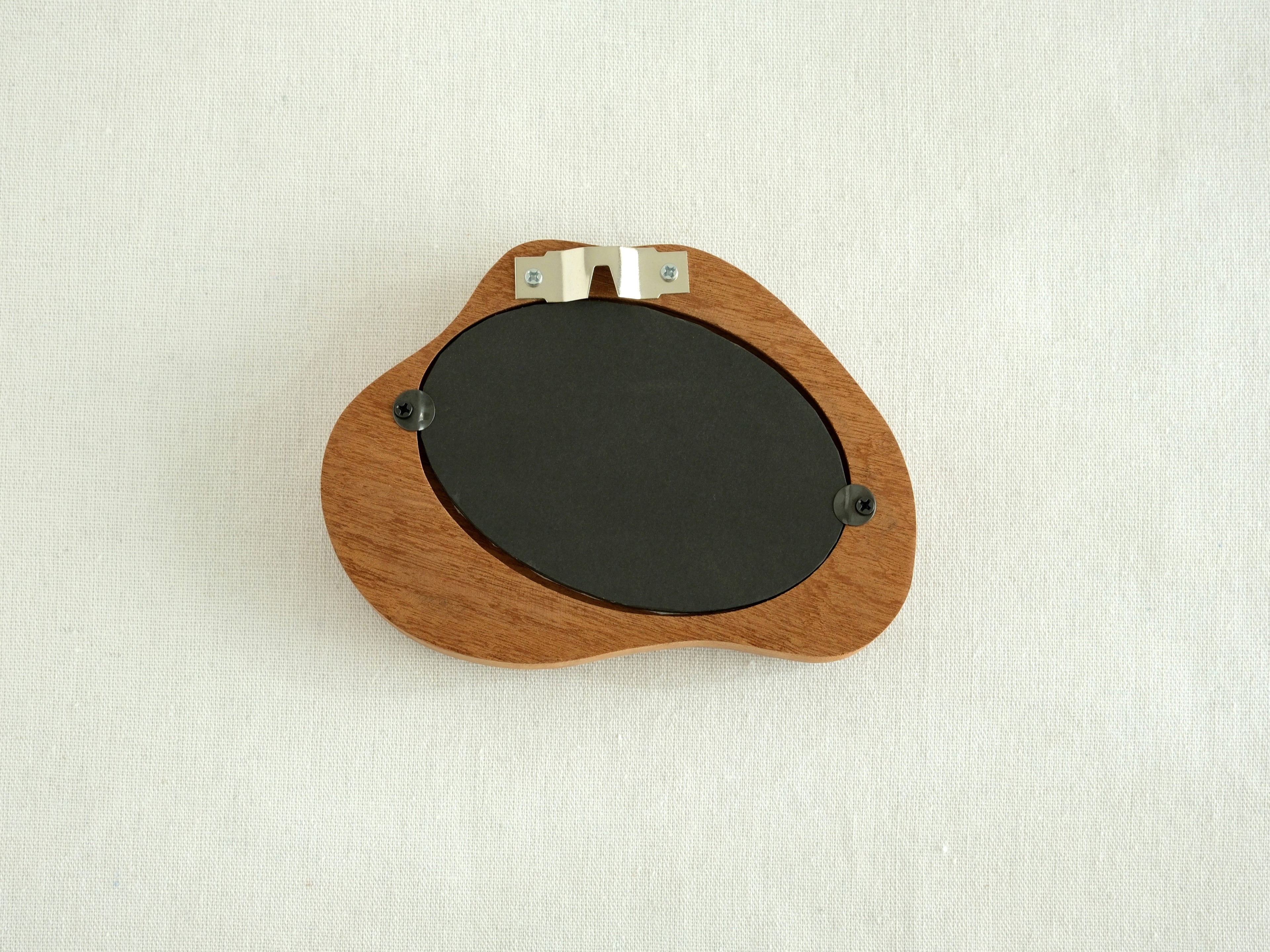 Back view of the cloud wood frame, showing the sturdy wall-mounting hook and secure backing hardware.