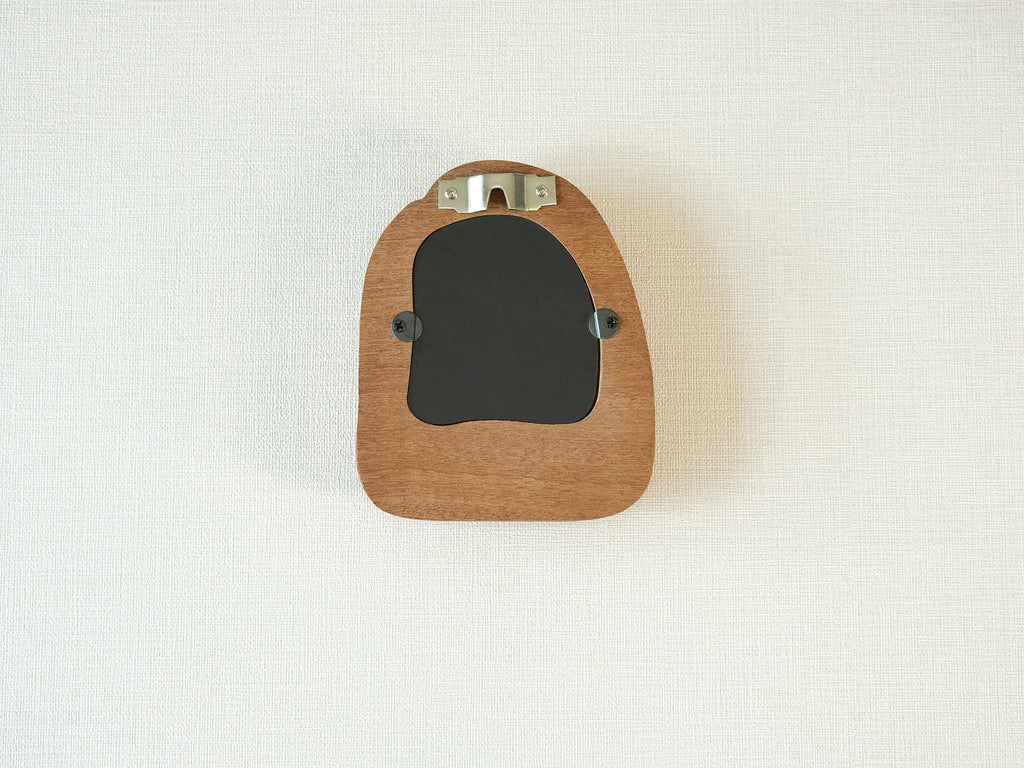 Back view of the house-shaped frame, featuring a sturdy sawtooth wall hanger and secure swivel tabs for artwork.