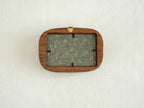 Back view of the walnut frame showing the wall hanger and easy-to-use clips for swapping art or personal photos.