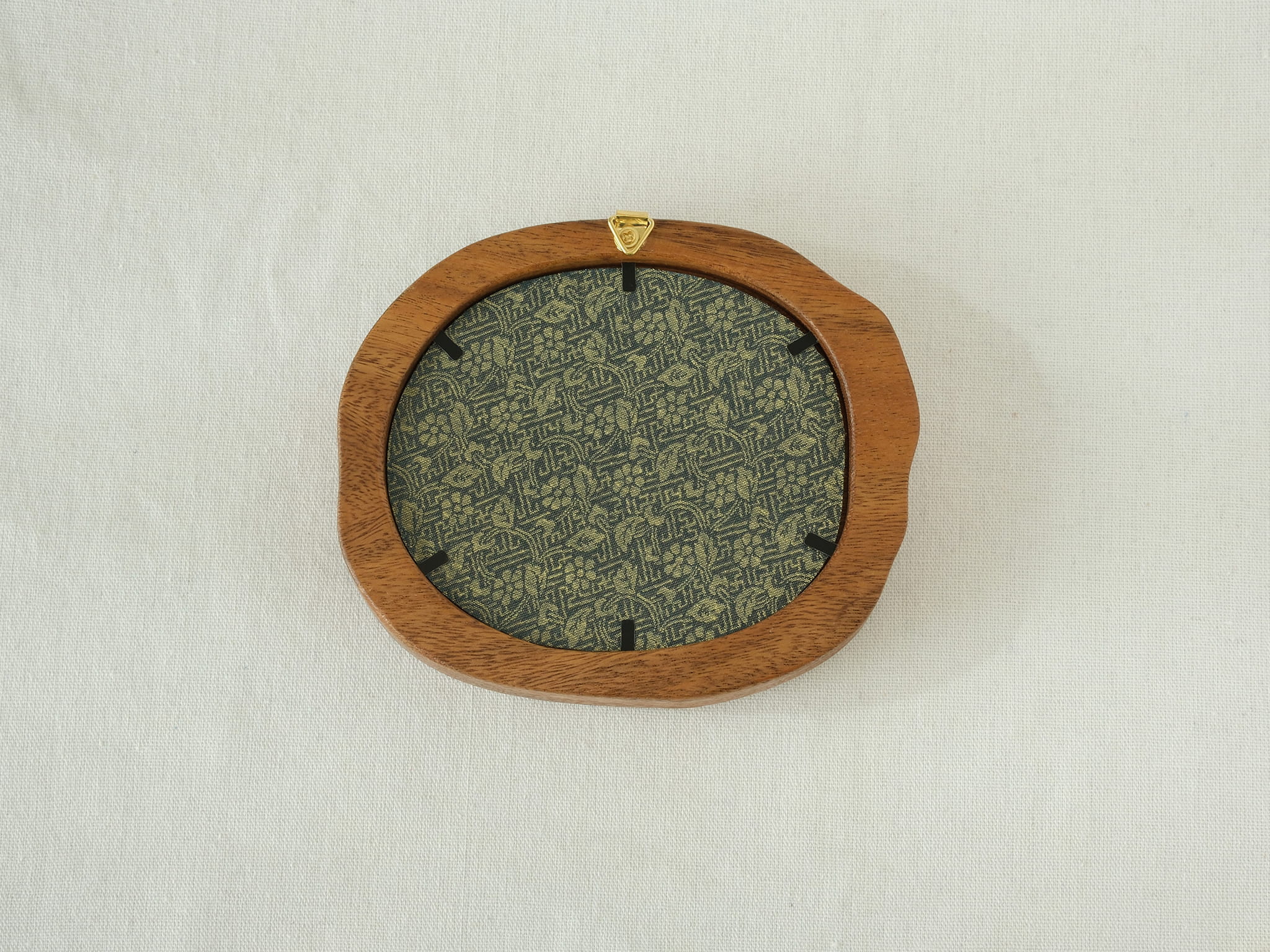 Rear view of the Fomjia wood frame showing the high-quality floral fabric backing, secure metal fasteners, and built-in hanging hardware.