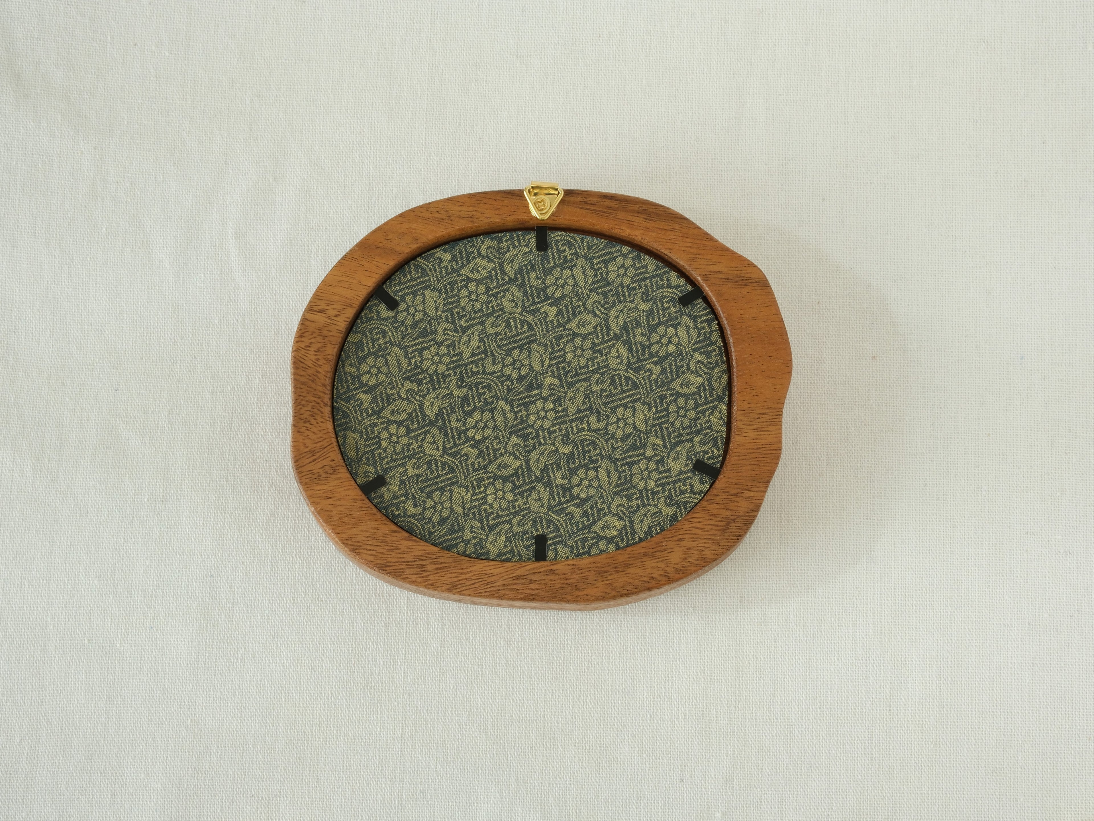 Rear view of the Fomjia wood frame showing the high-quality floral fabric backing, secure metal fasteners, and built-in hanging hardware.