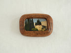 Handcrafted South American walnut wood picture frame with organic chunky shape and a landscape art print.