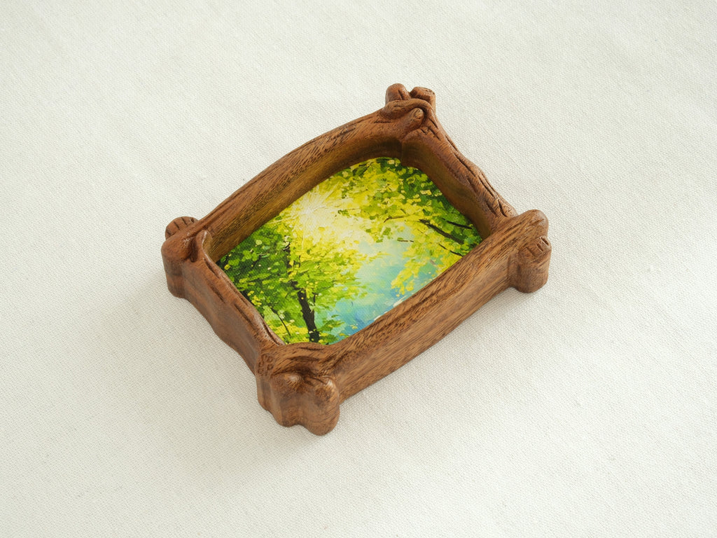 A top-down perspective of the organic wood frame, highlighting its unique branch-shaped silhouette and natural wood grain.